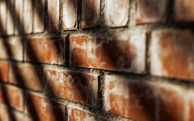 Abstract pattern of light and shadow on a wall.